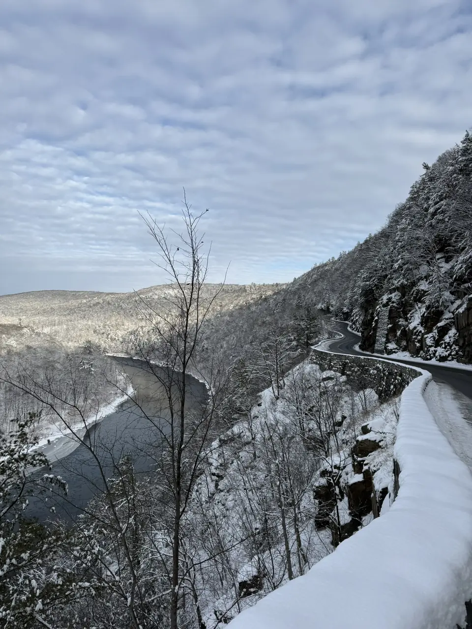 Route 97 winding along the cliffs at Hawk's Nest after snow