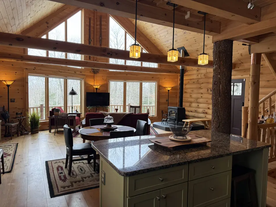 View from the kitchen island across the dining area to the great room
