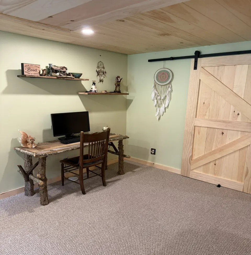 Lower level desk nook with a sliding barn door